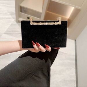 Elegant Black Clutch with Gold Handle